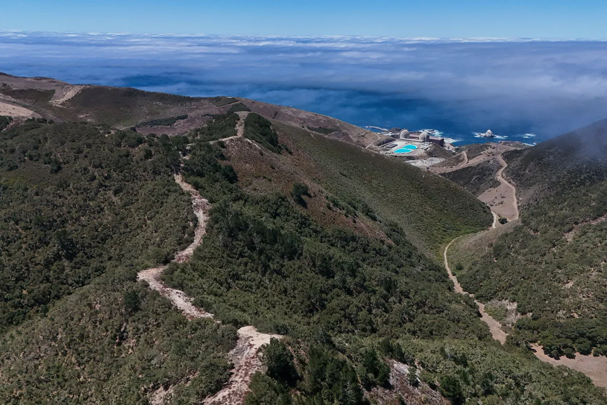 An aerial view of a fuel break carved into a ridgeline near Diablo Canyon Power Plant in San Luis Obispo County on July 22, 2026. Photo by Larry Valenzuela, CalMatters